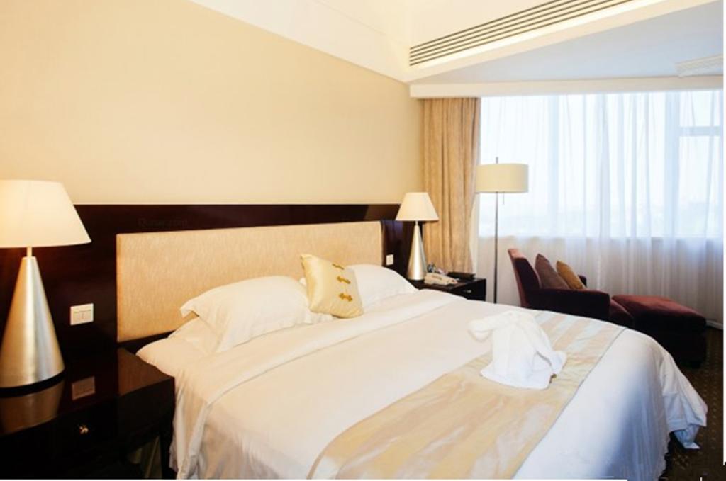 Tienyow Grand Hotel Haikou  Quarto foto